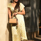 A woman holding Zenkindstore's Mini Duffle Bag